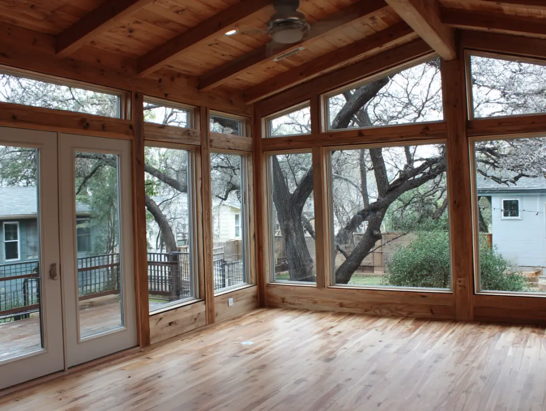 Master suite room addition in Austin TX featuring spacious bedroom with vaulted ceilings and luxury finishes